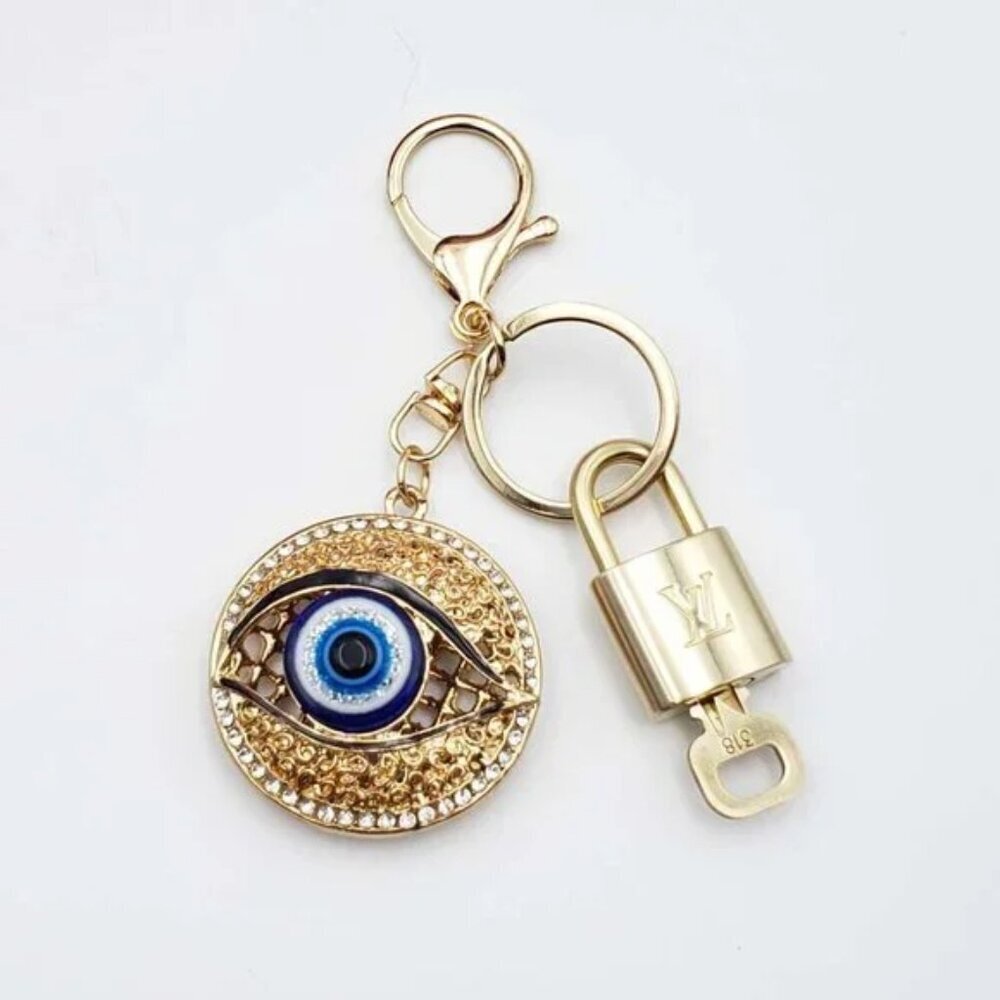 Authentic Louis Vuitton Gold Lock 🔒 Keychain Bag Unbranded Evil Eye Charm LV - Picture 1 of 7